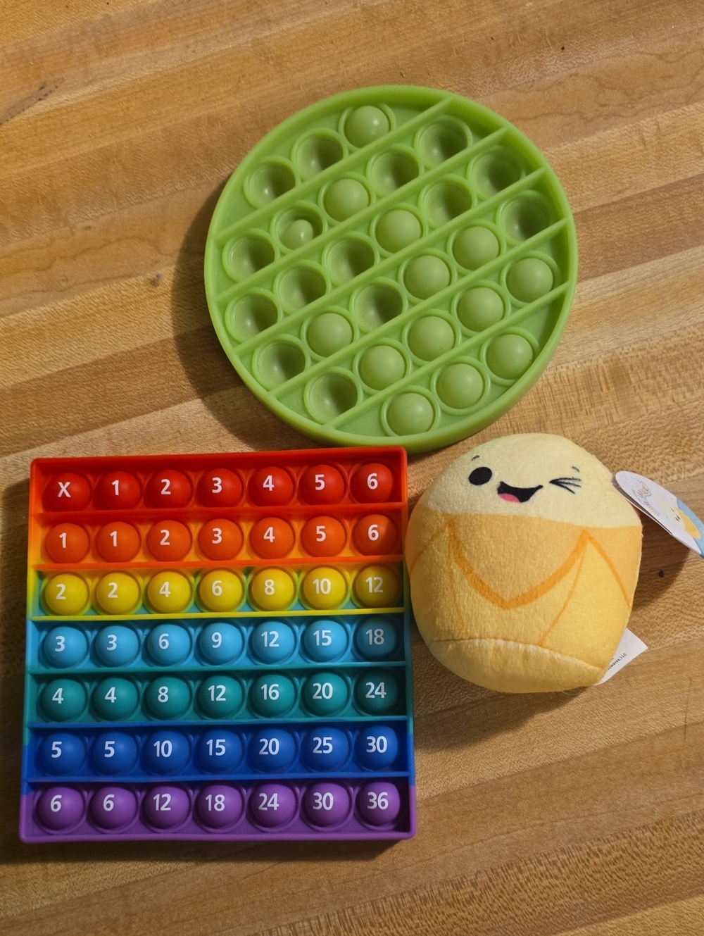 Rainbow Popit Counting Fidget Toy, Green Circle, and Junie Squishmallow Plush